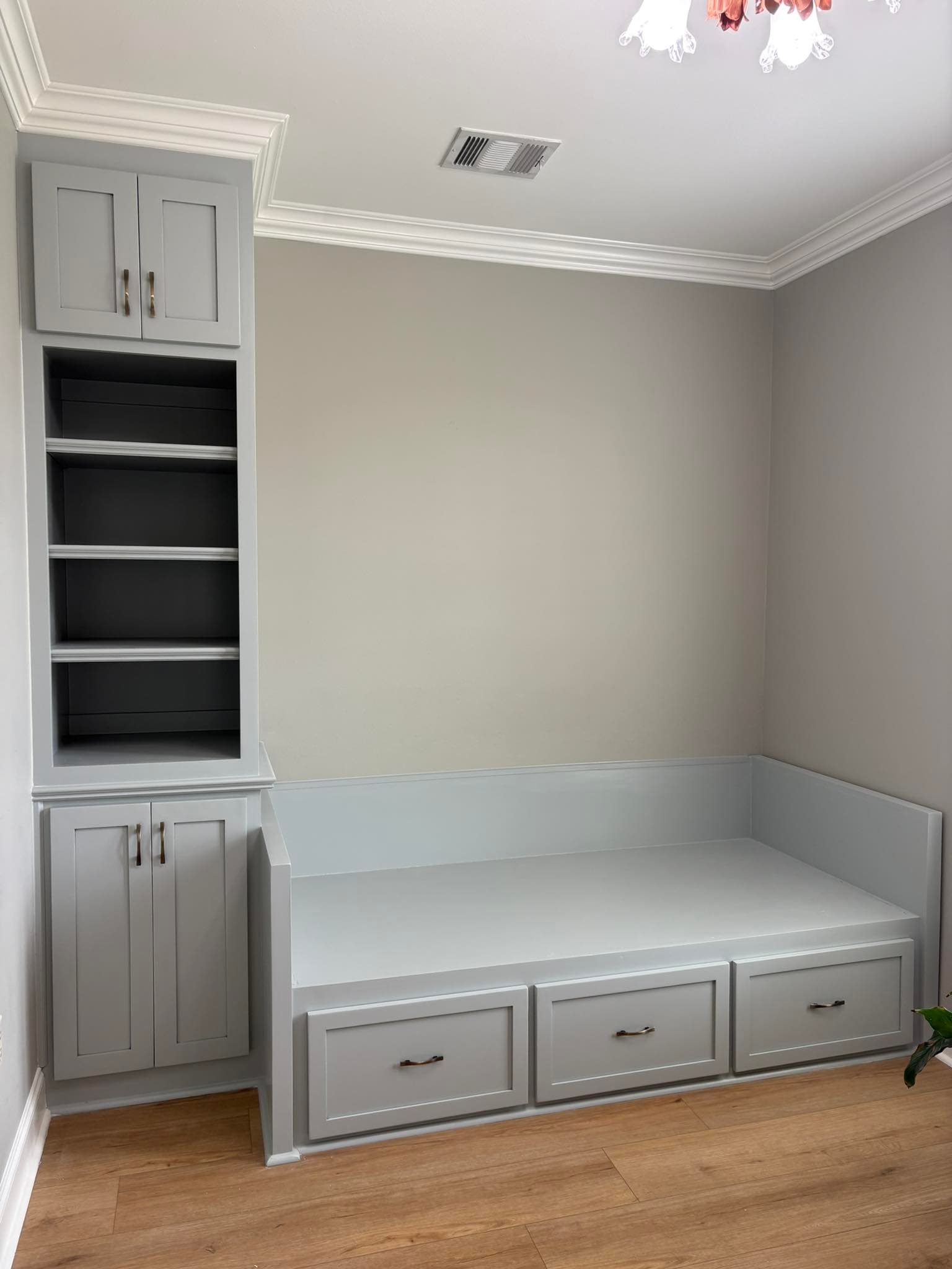 Custom built-in cabinetry and storage bed by Southdown Renovations